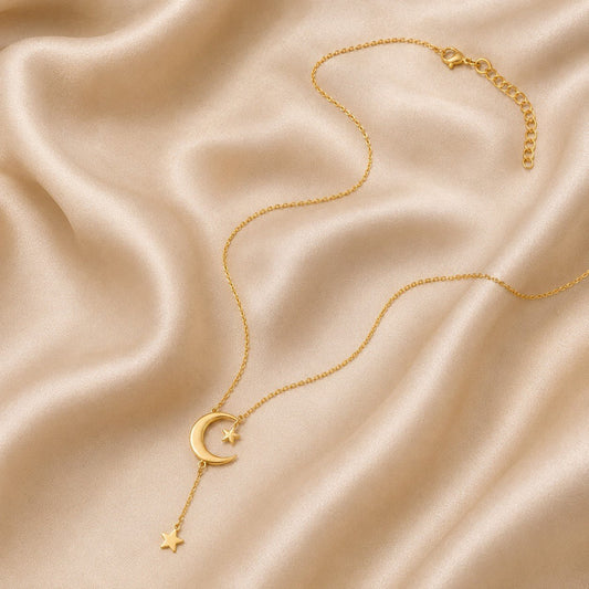 Moon and Star Pendant Necklace in 18K gold vermeil featuring a crescent moon and delicate hanging stars